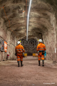 People walking into mine