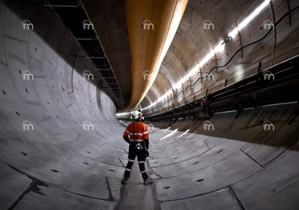 Mineglow LED strip lighting illuminating a hydro tunnel construction project, providing continuous lighting to improve visibility, worker safety and construction efficiency.
